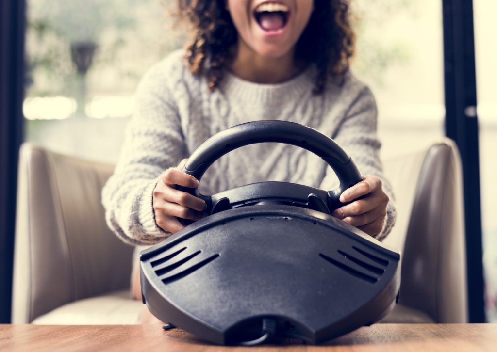Woman playing a sim racing game